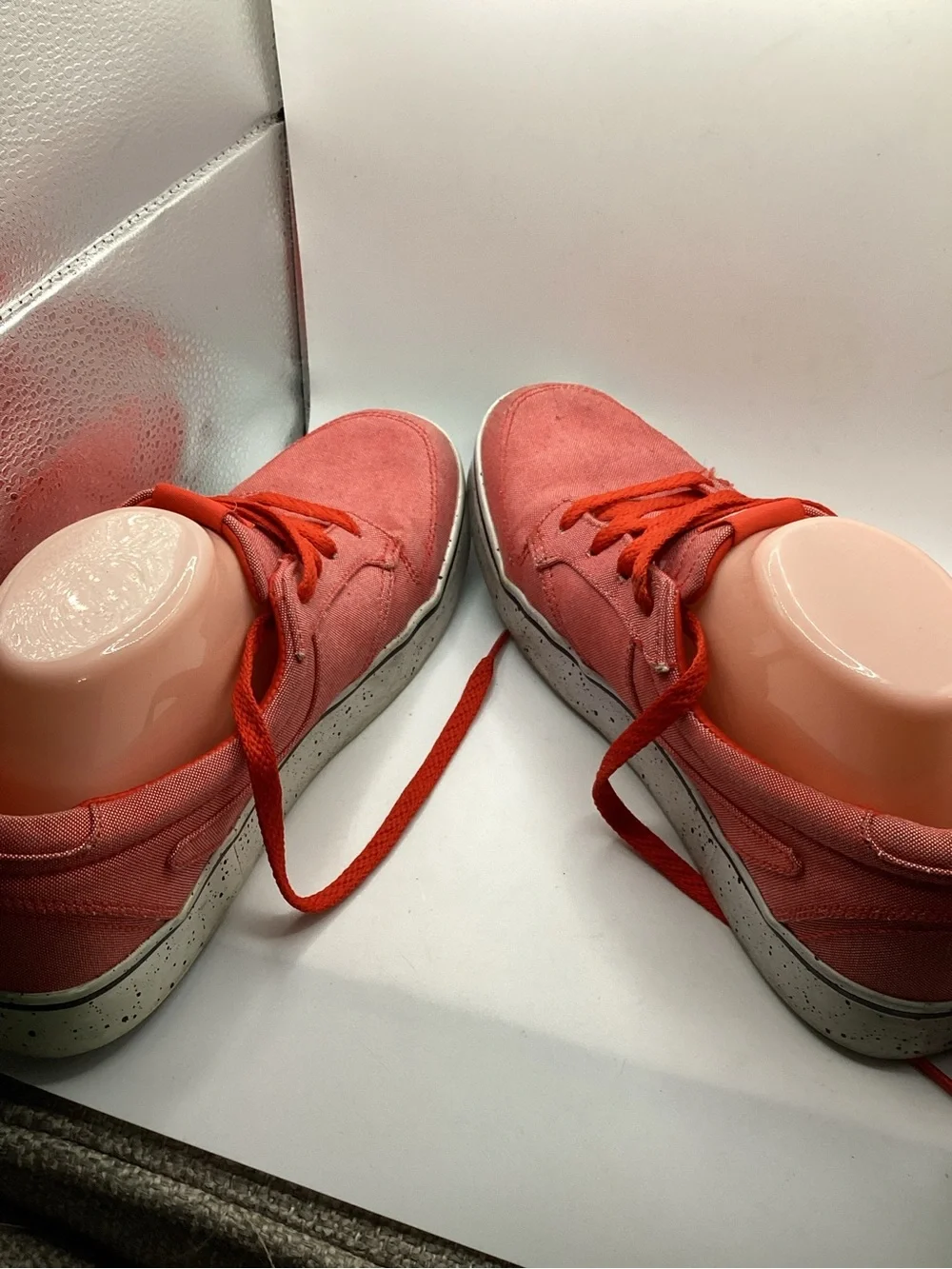 Nike 6.0 skate shoes featuring a vibrant red canvas upper and a speckled midsole